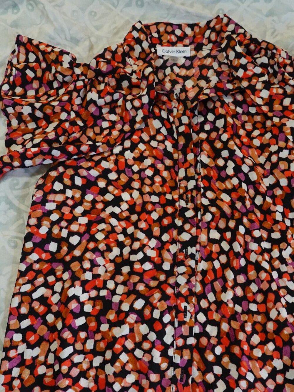 Calvin Klein Button up short sleeve blouse.
